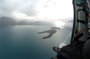 Aerial helicopter shot over water, Queenstown