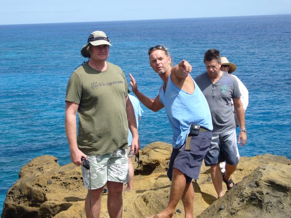 Crew scouting cliffside location, Hawaii