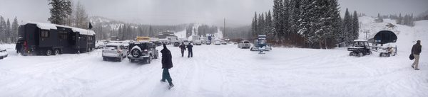Panoramic view of production vehicles and crew in snow, Utah