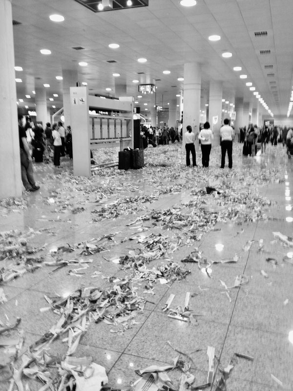 Airport terminal floor covered in ticker tape debris, Croatia