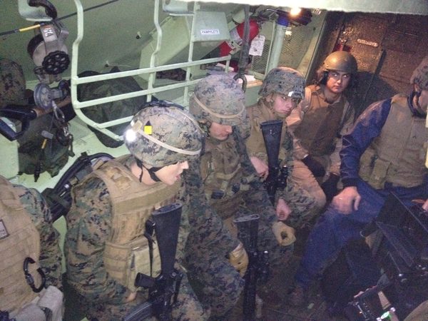 Marines inside a military transport vehicle on set, Southern California