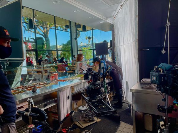 Camera crew filming behind the counter of a restaurant, Seattle