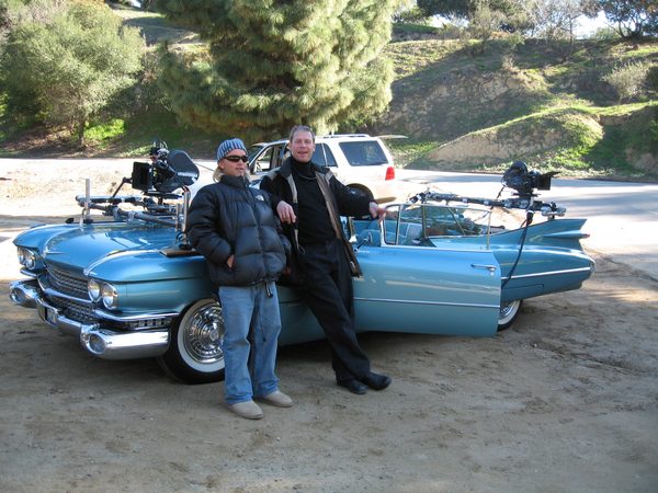 Vintage Cadillac convertible with camera rig mounted, crew posing, Los Angeles