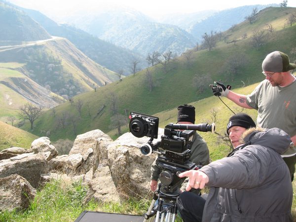 Camera crew filming from a canyon overlook, Los Angeles