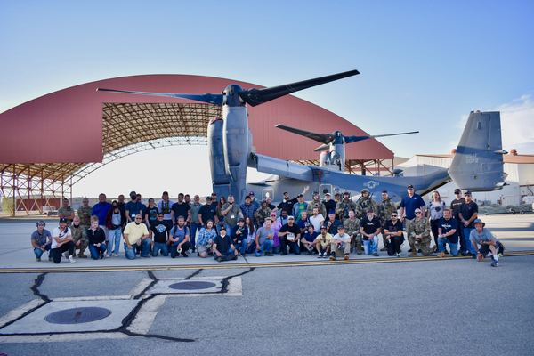 Cast and crew group photo in front of a V-22 Osprey, U.S. Air Force