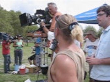 Camera crew filming outdoors under a canopy tent, Argentina