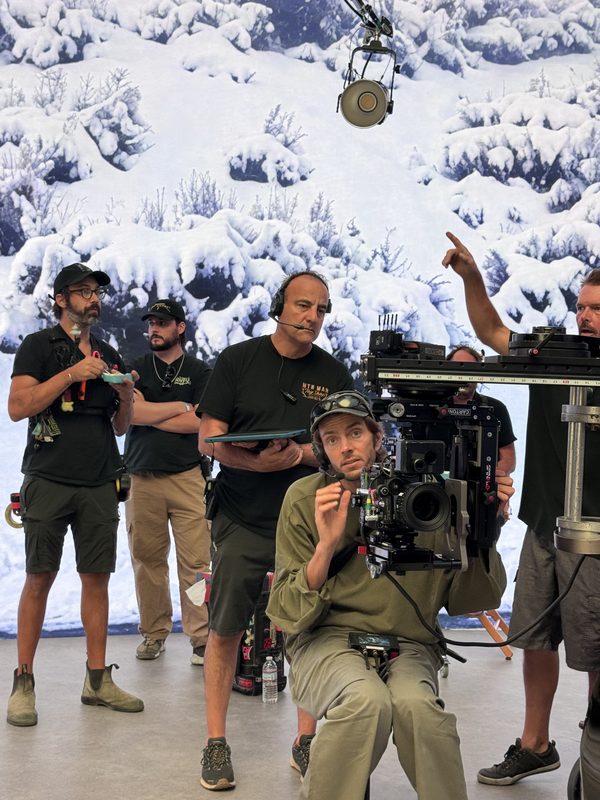 Crew operating a camera rig on an LED volume stage with a snowy backdrop, Los Angeles