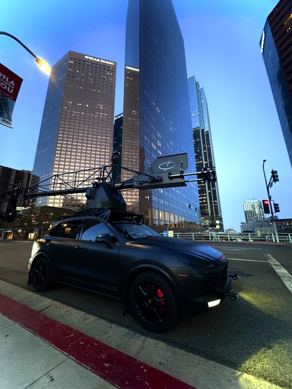 Camera car with jib rig on a downtown Los Angeles street at dusk