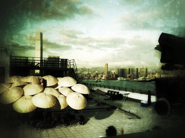 Rooftop lighting setup with harbor skyline, Hong Kong