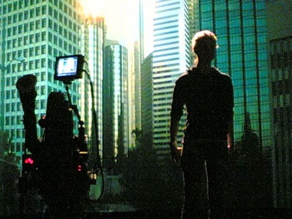 Silhouette against LED city backdrop, Los Angeles
