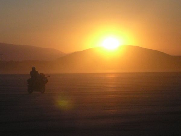 Motorcycle silhouette at sunset, Mojave Desert