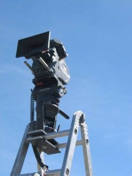 Camera rig on ladder against sky, New Zealand