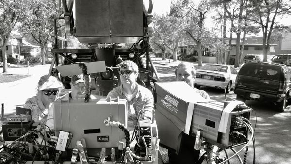 Camera crane rig and crew on residential street, Colorado