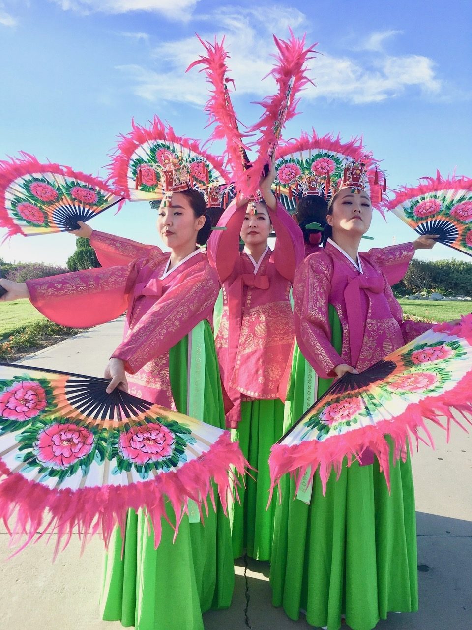Fan dancers close-up with feathered fans, Los Angeles