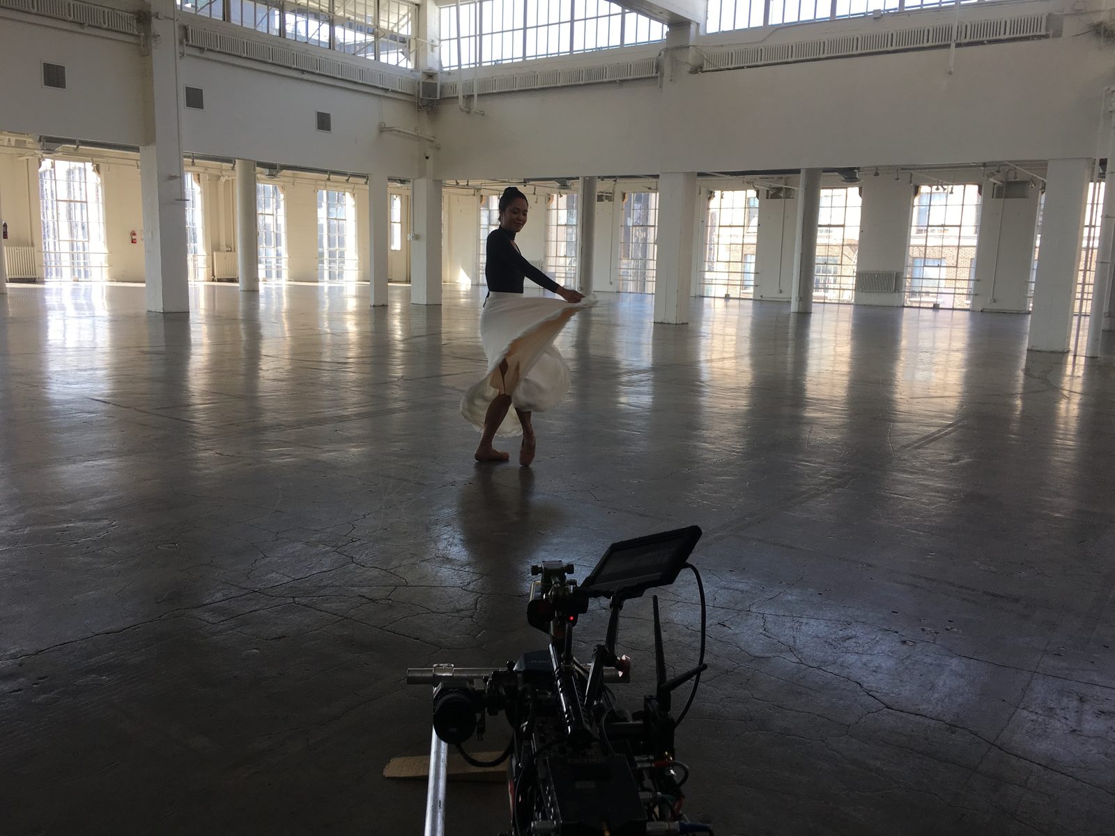 Ballet dancer in sunlit loft space, Los Angeles