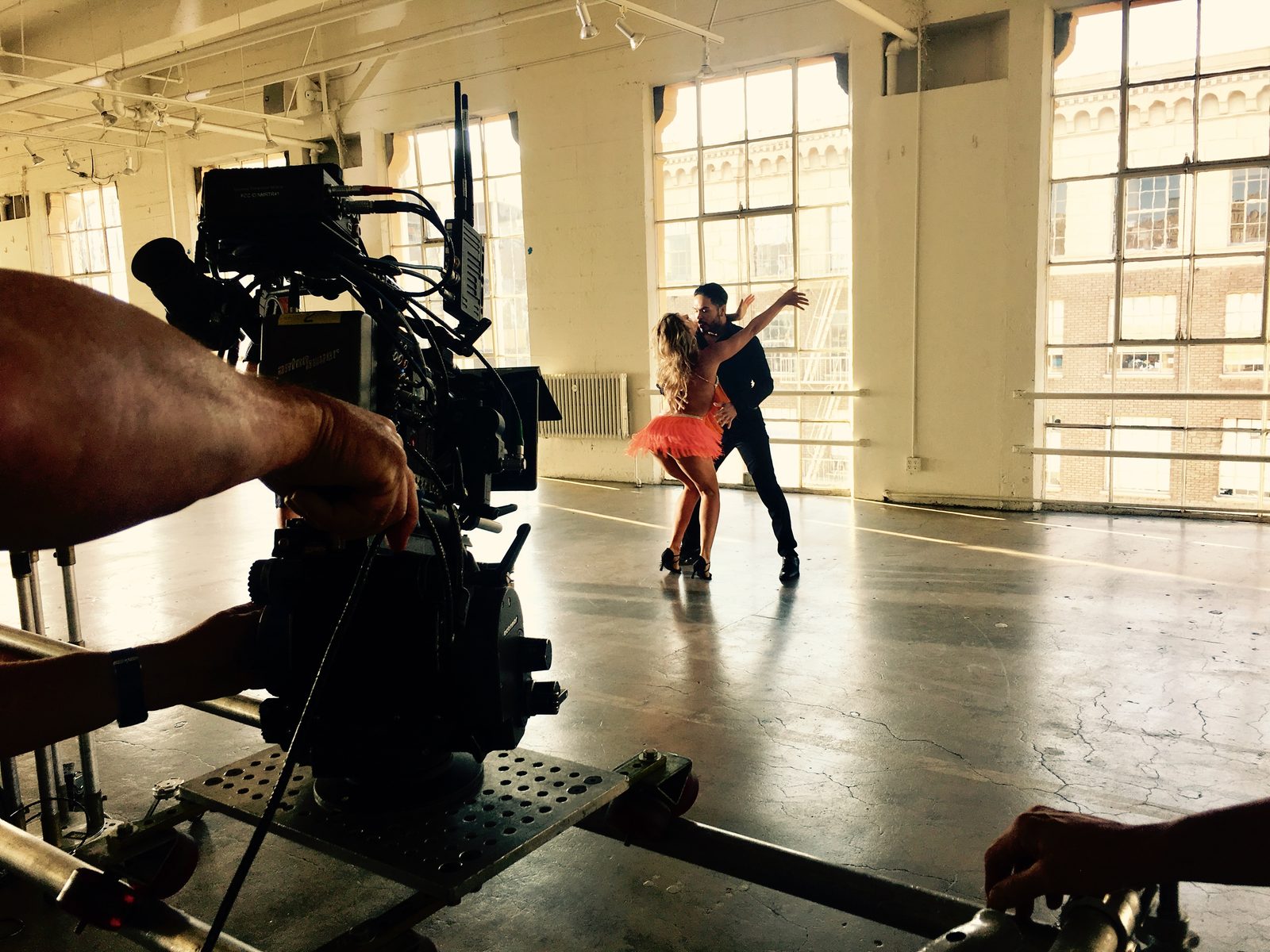 Ballroom dance couple in sunlit studio, Los Angeles